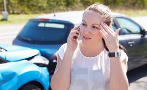 Female Driver Making Phone Call After an Accident